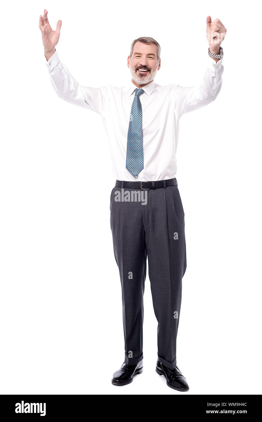 Full length of successful businessman raising his arms Stock Photo - Alamy
