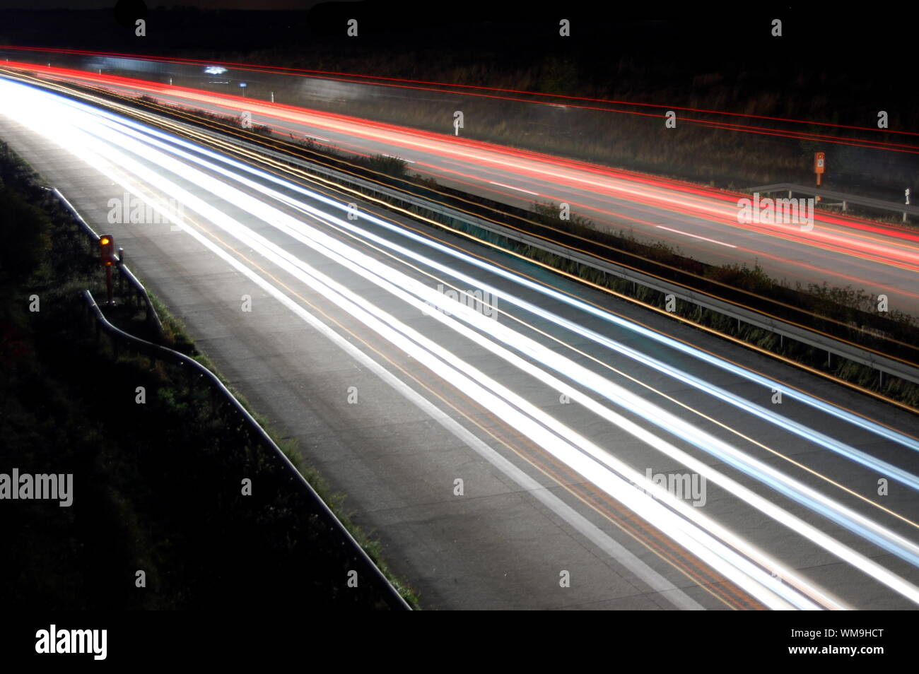 highway at night with car traffic and lights Stock Photo
