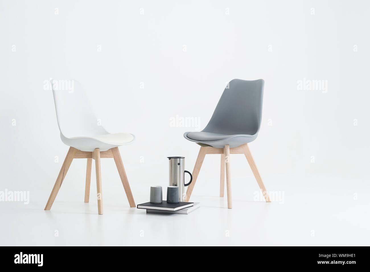 Two Modern Chairs With A Serving Of Coffee In A Stylish
