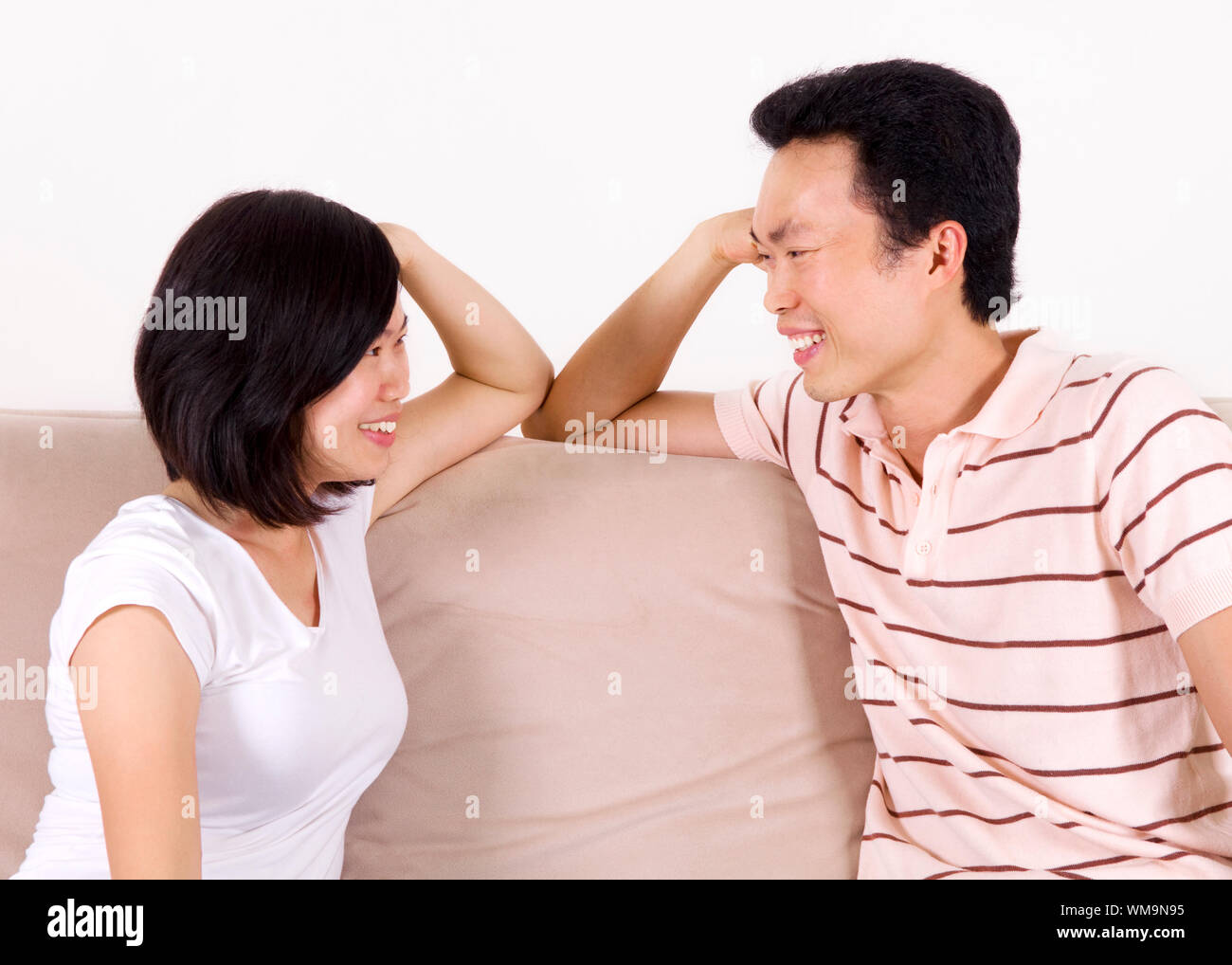 Happy Couple Having Conversation Face To Face And Looking At Each Other Stock Photo Alamy