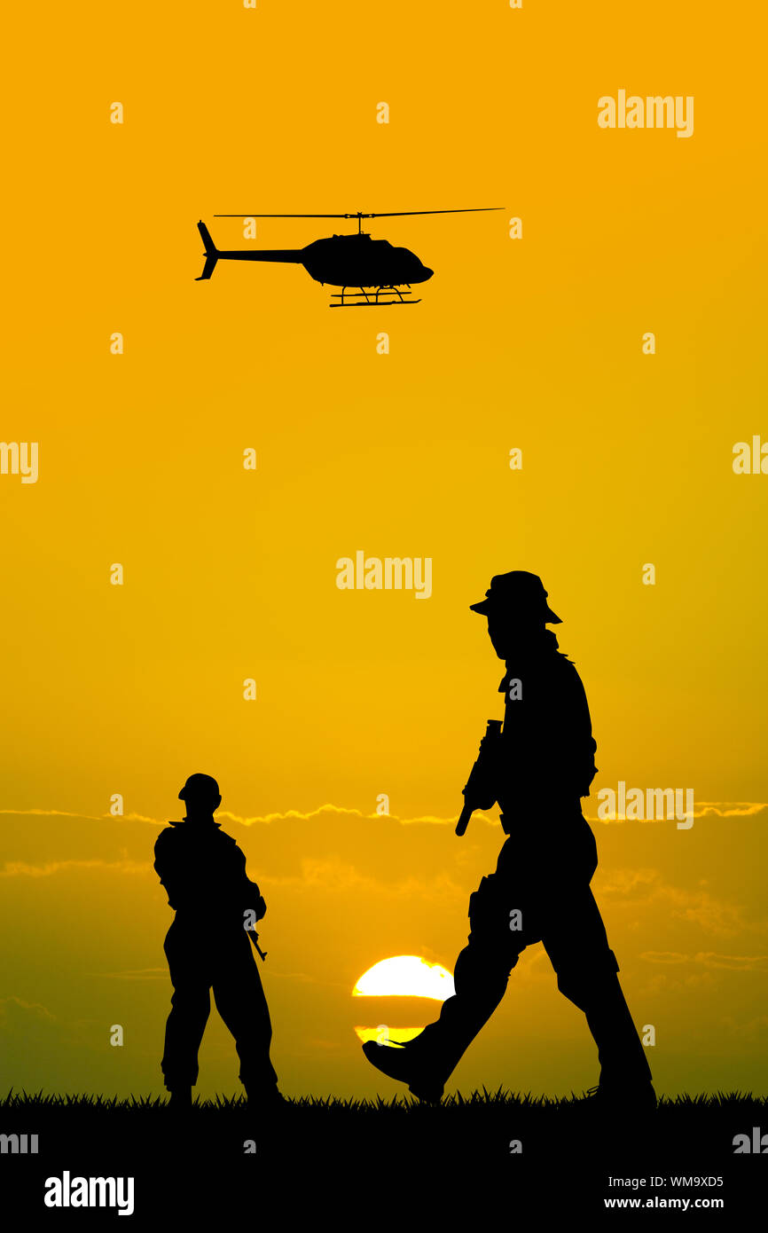 soldiers silhouette at sunset Stock Photo