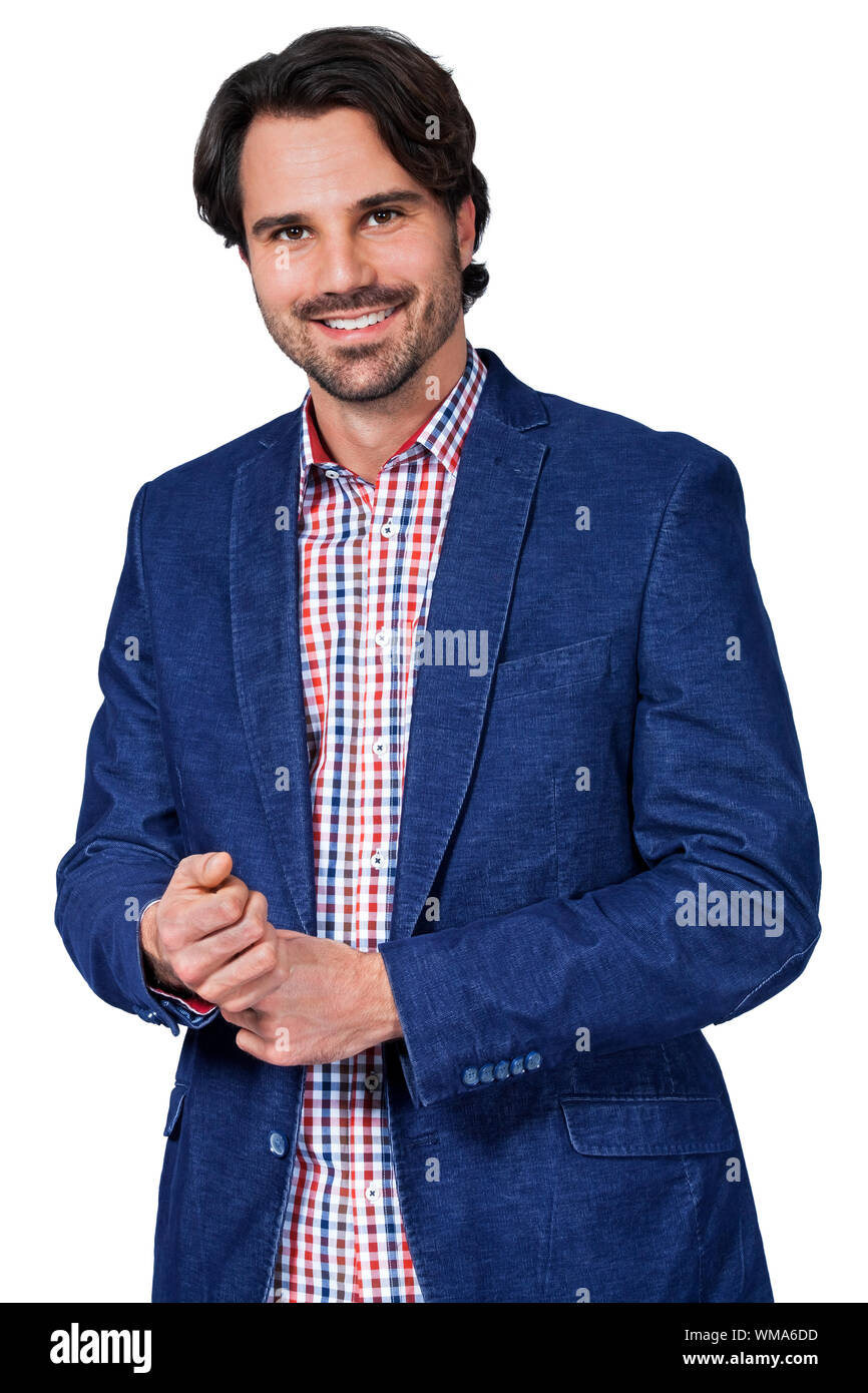 Handsome smiling man in stylish leisurewear approaching the camera in a ...