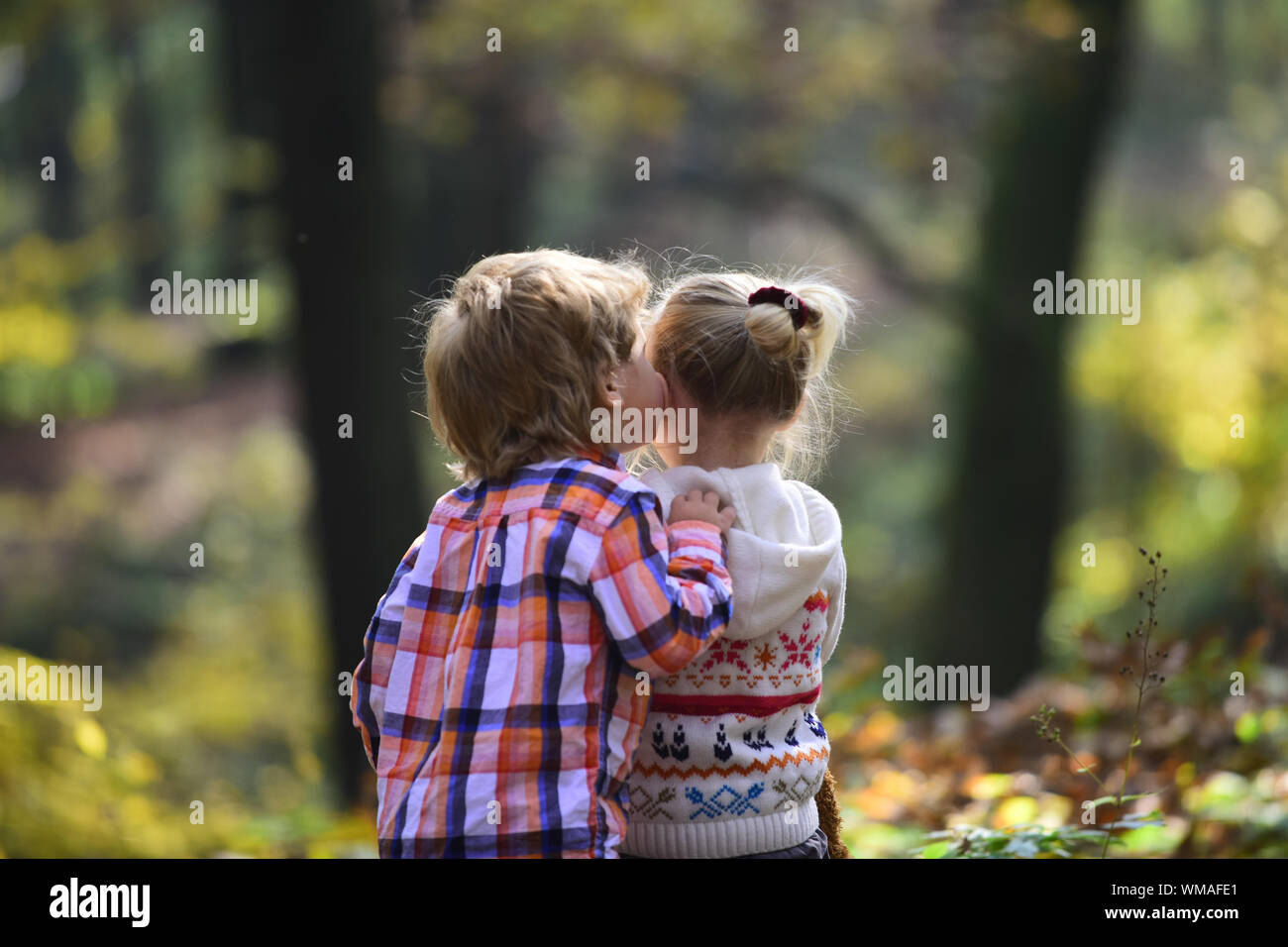 Childhood kiss, love and trust. Childhood friendship and children early development Stock Photo