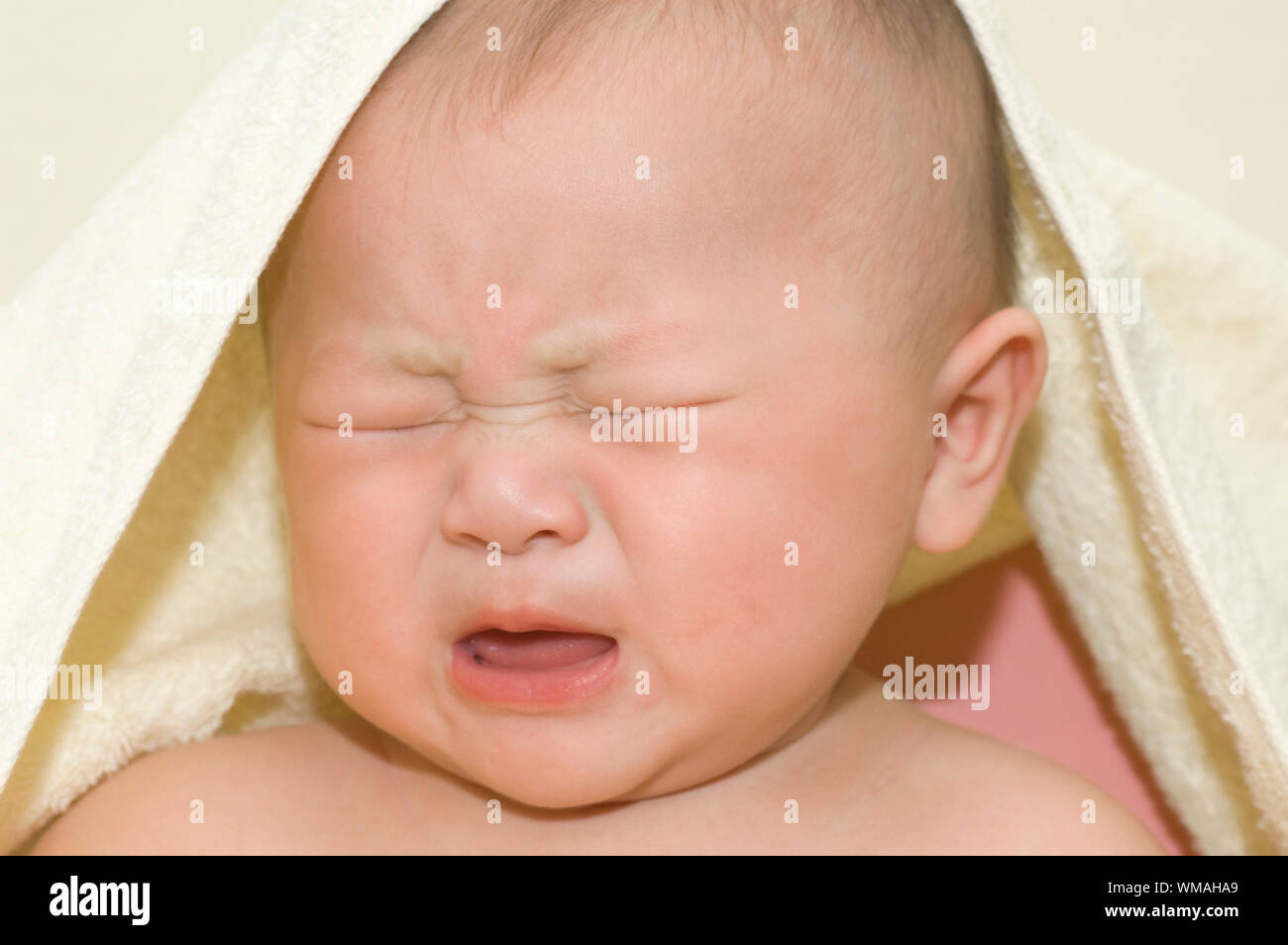 Crying 6 months old Asian baby boy Stock Photo Alamy