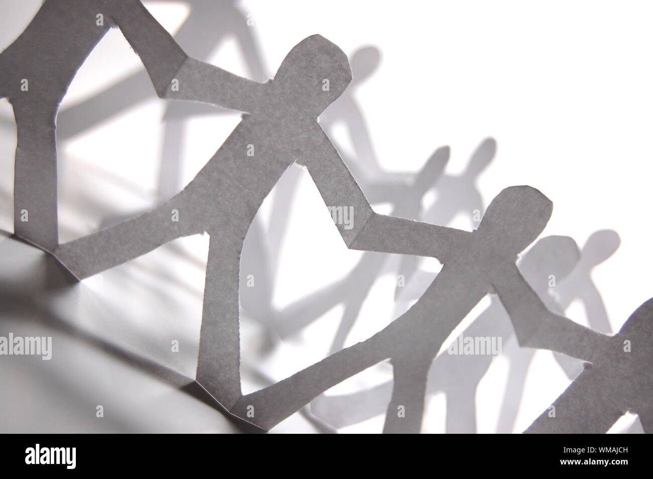 team of paper people having a party Stock Photo Alamy