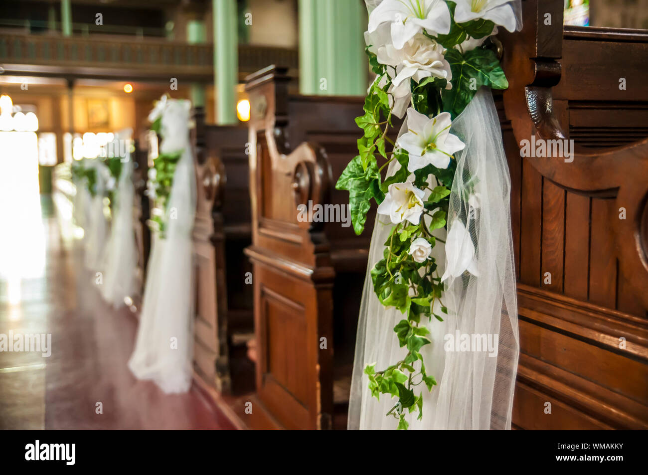 Wedding Decoration White Flowers And Green Leafs Hanging On The