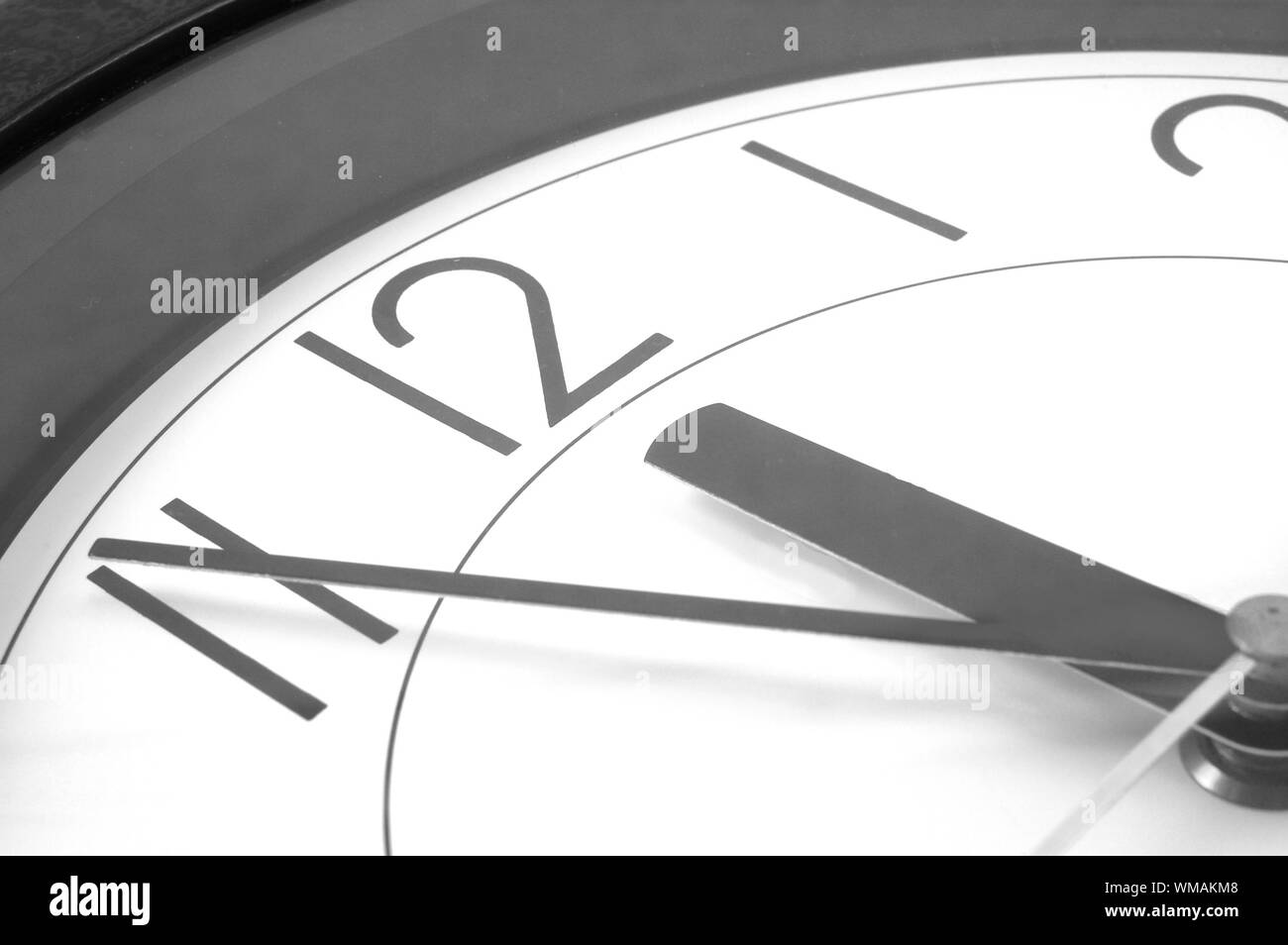 wall clock at 12. time is running out Stock Photo