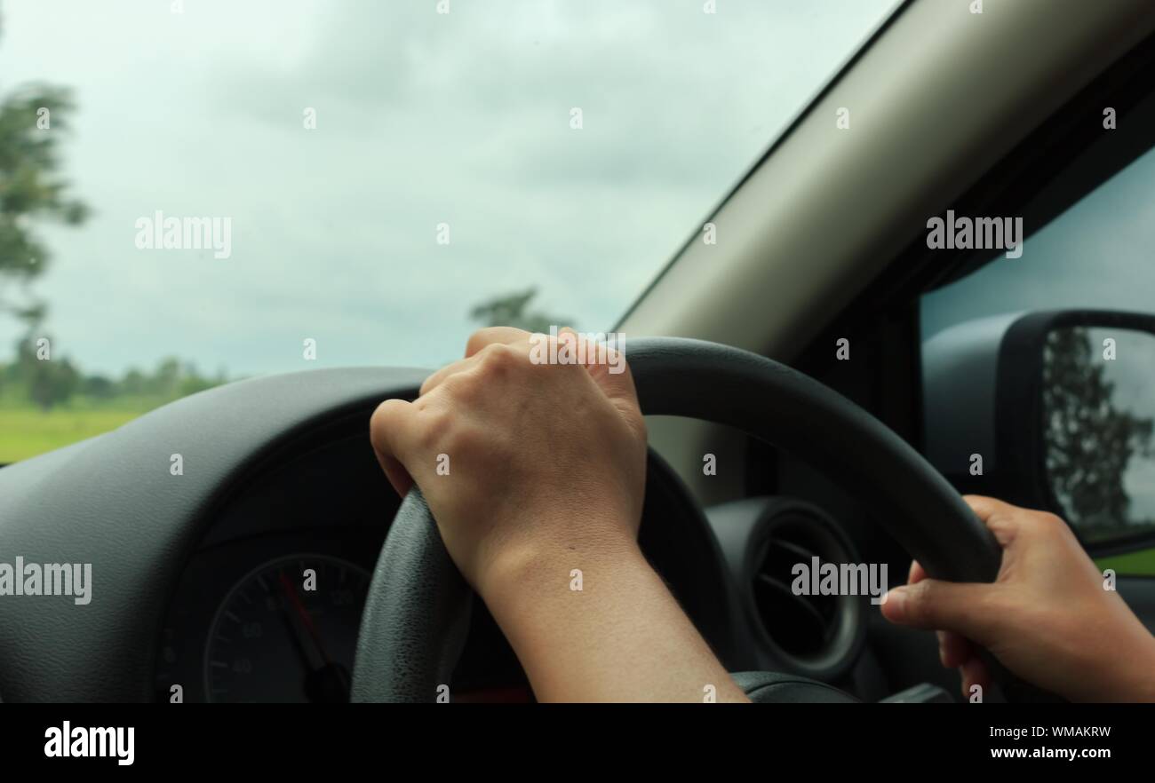 Woman hand steering wheel hi-res stock photography and images - Alamy