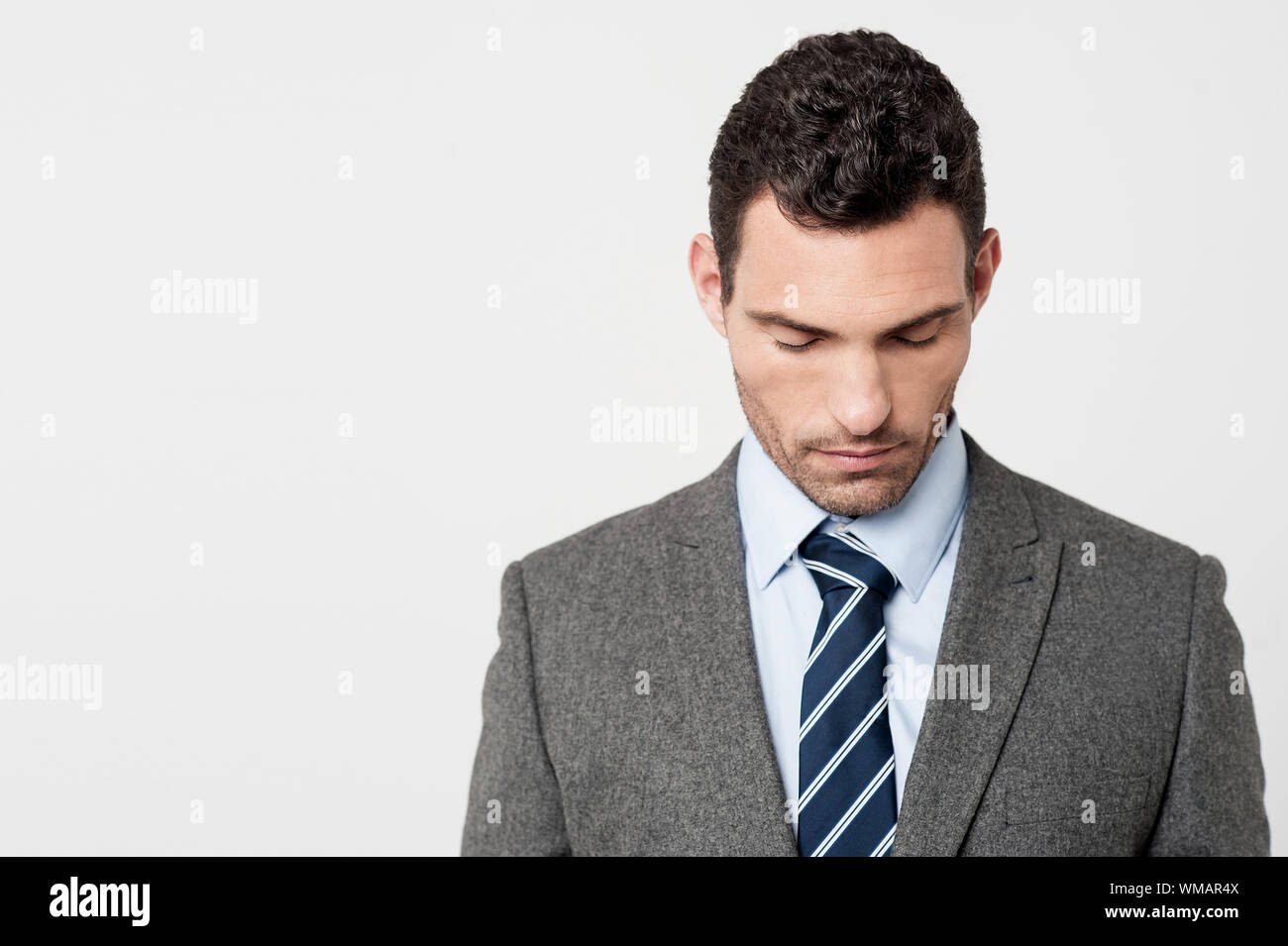 Worried businessman bending head down Stock Photo Alamy
