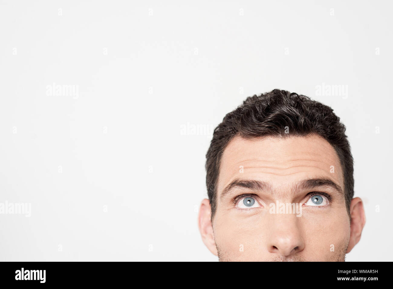 Half faced image of an man looking upwards Stock Photo Alamy
