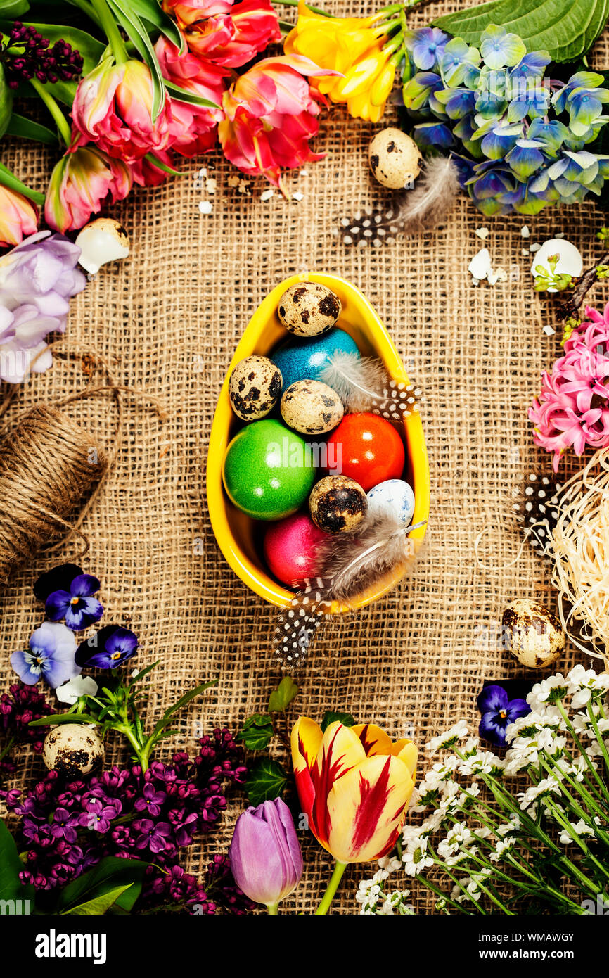 Easter background with eggs, nest and flowers Stock Photo - Alamy