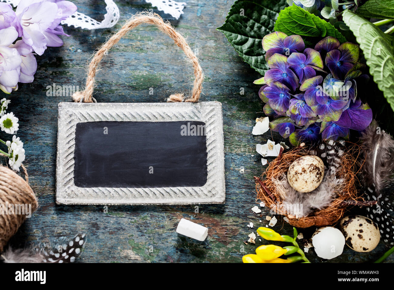 Easter background with eggs, nest and flowers Stock Photo - Alamy