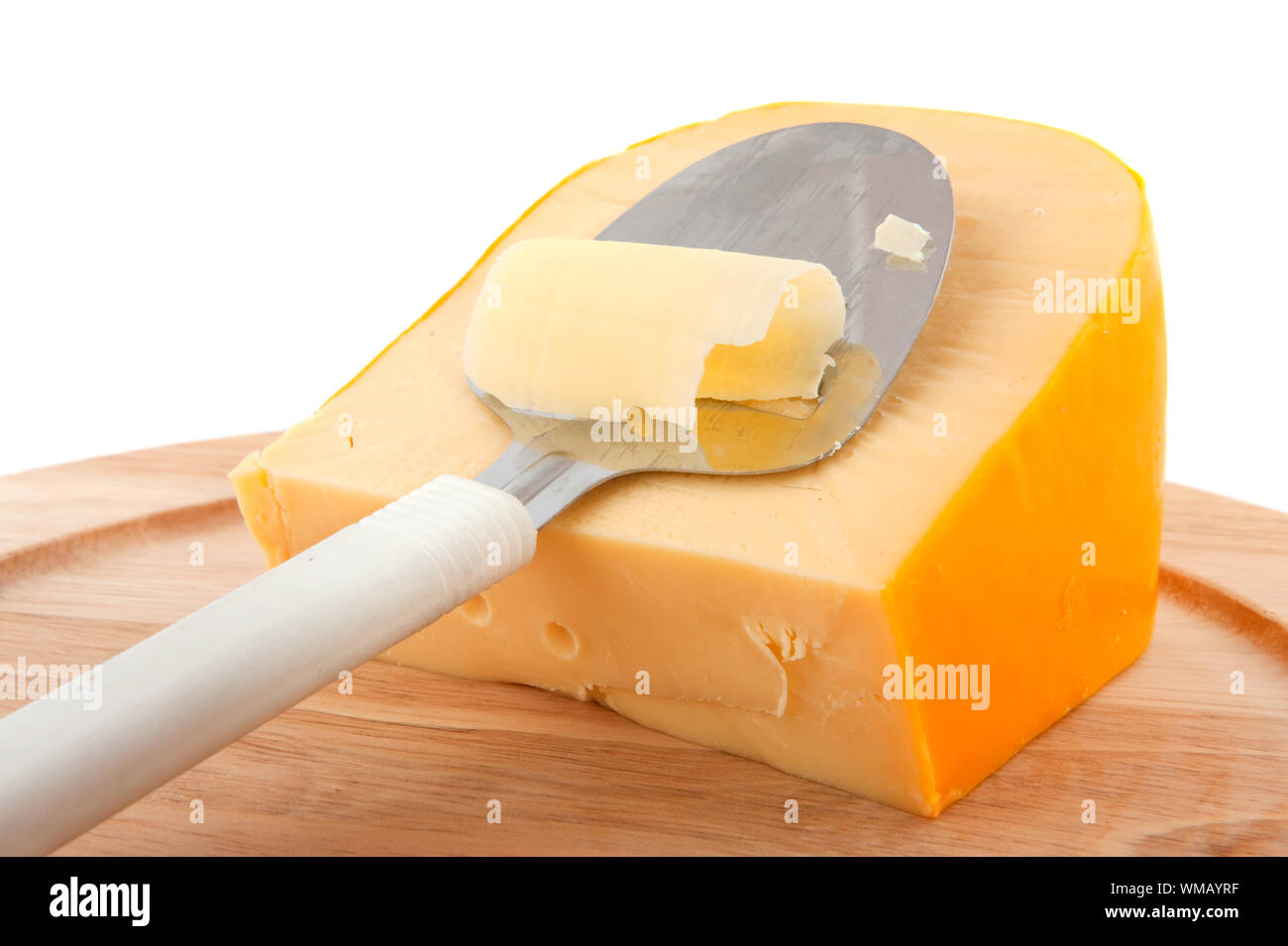 Dutch cheese with typical slicer isolated over white Stock Photo Alamy