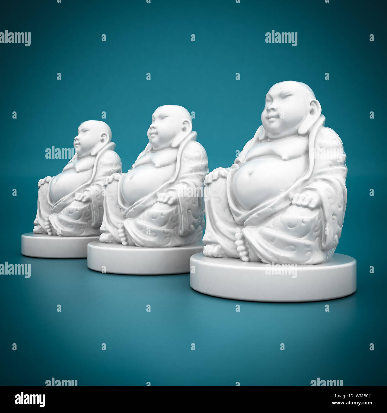 Image of a white statue of buddha on blue background stock photo alamy