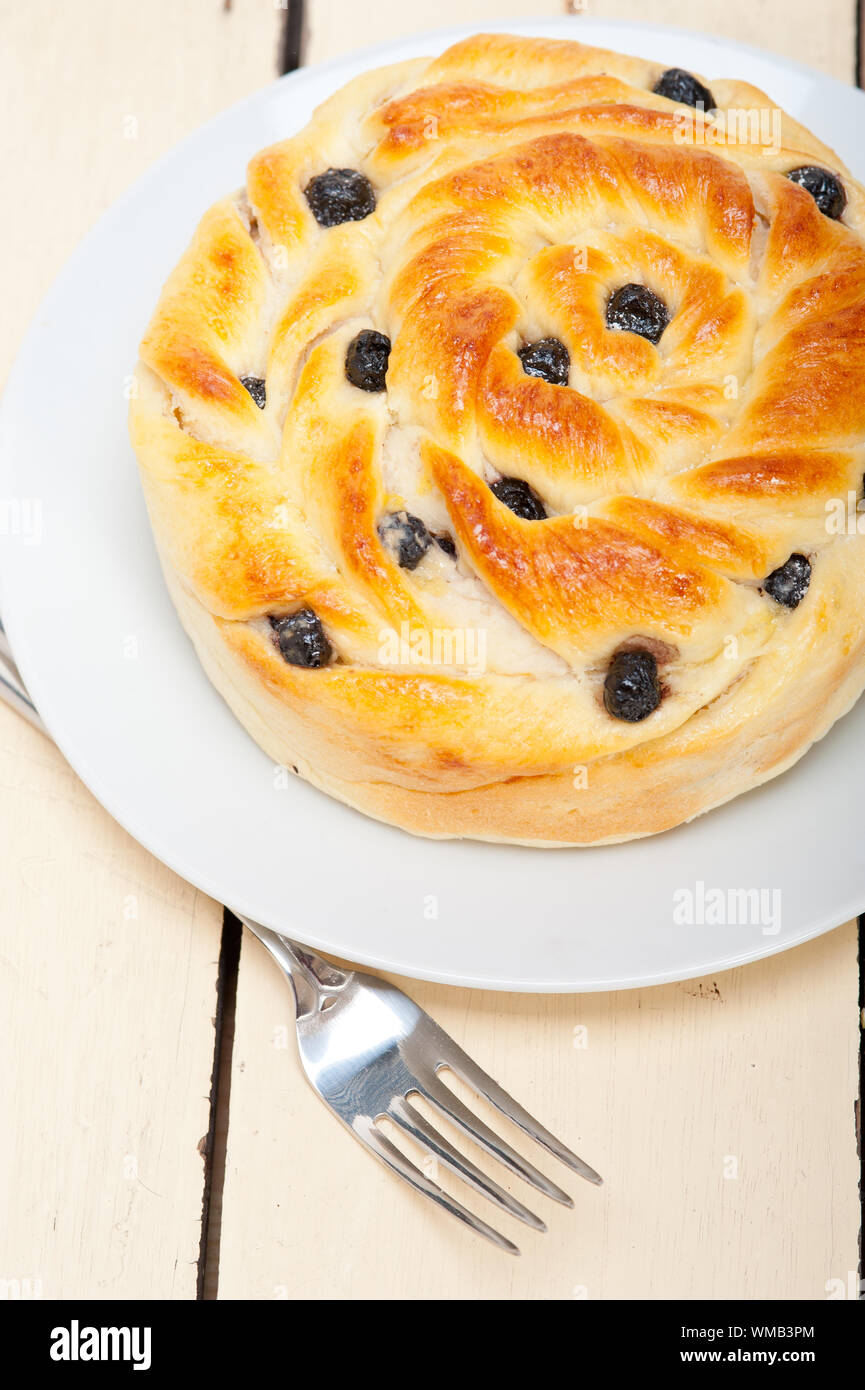 fresh home baked blueberry bread cake dessert over white wood table