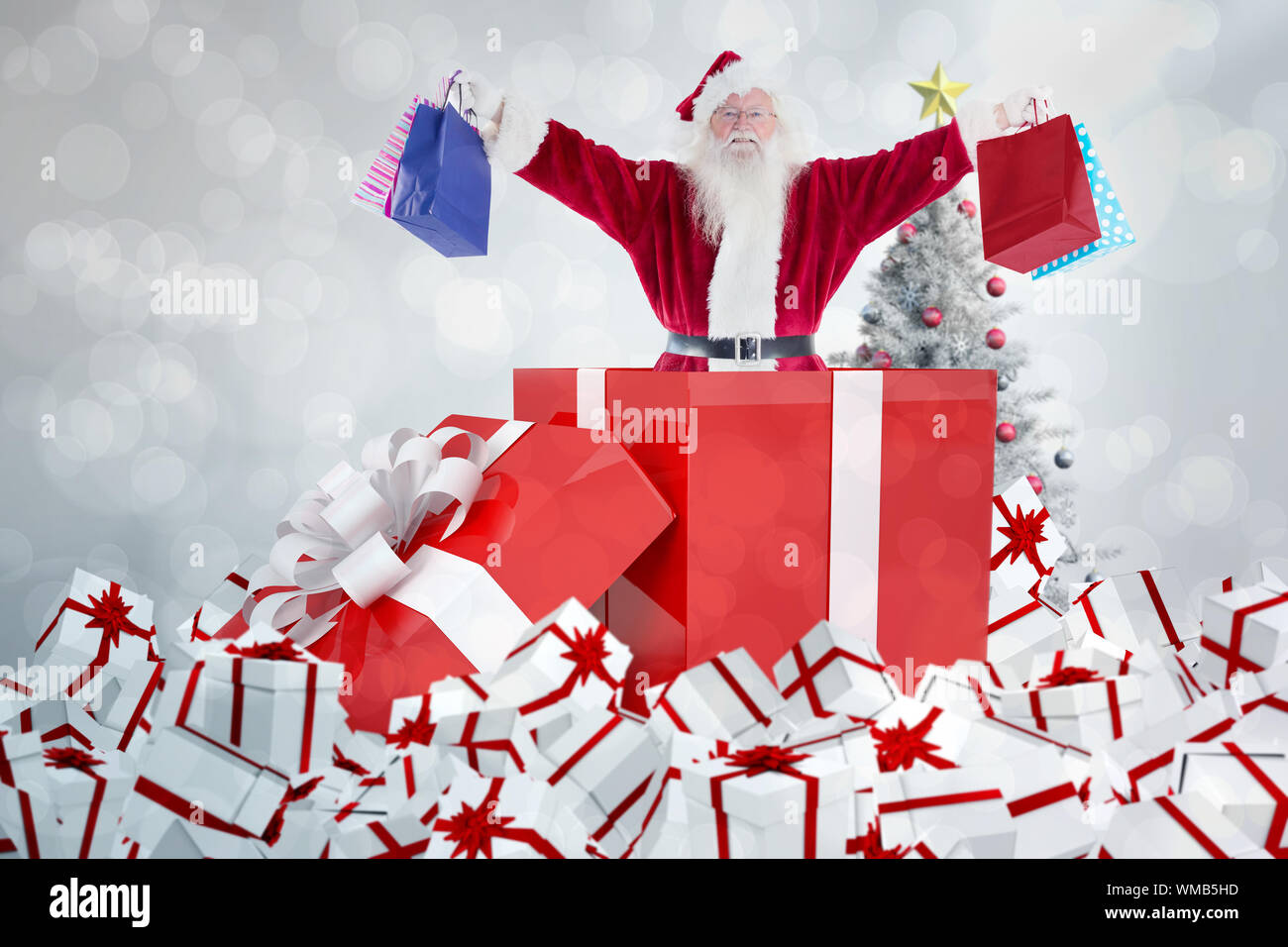 Santa standing in large gift against light glowing dots design pattern ...