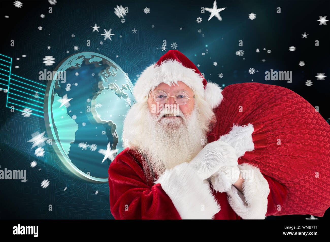 Jolly Santa carries his sack against shiny globe on black background ...