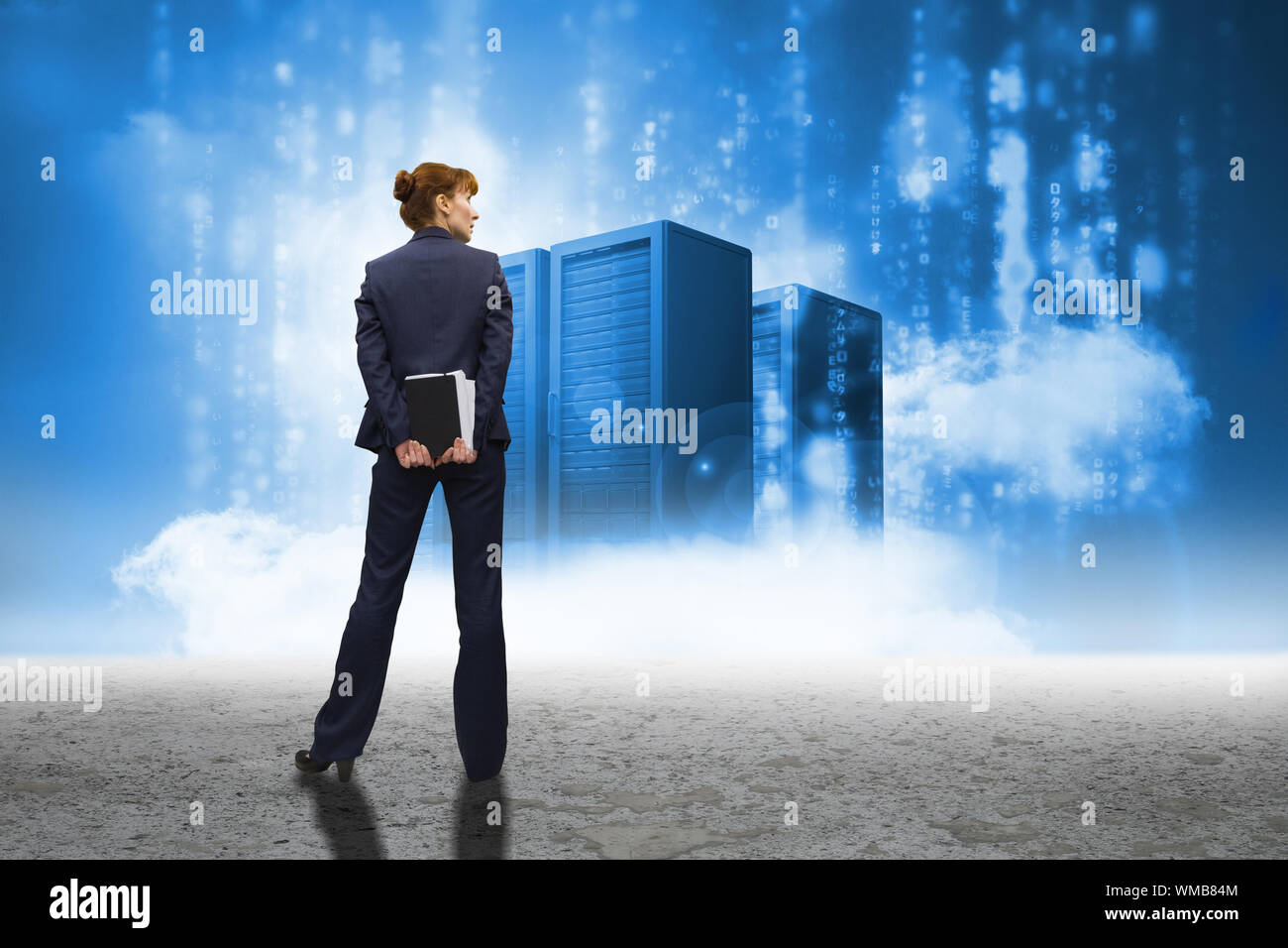 Businesswoman looking against cloud computing graphic with server Stock Photo