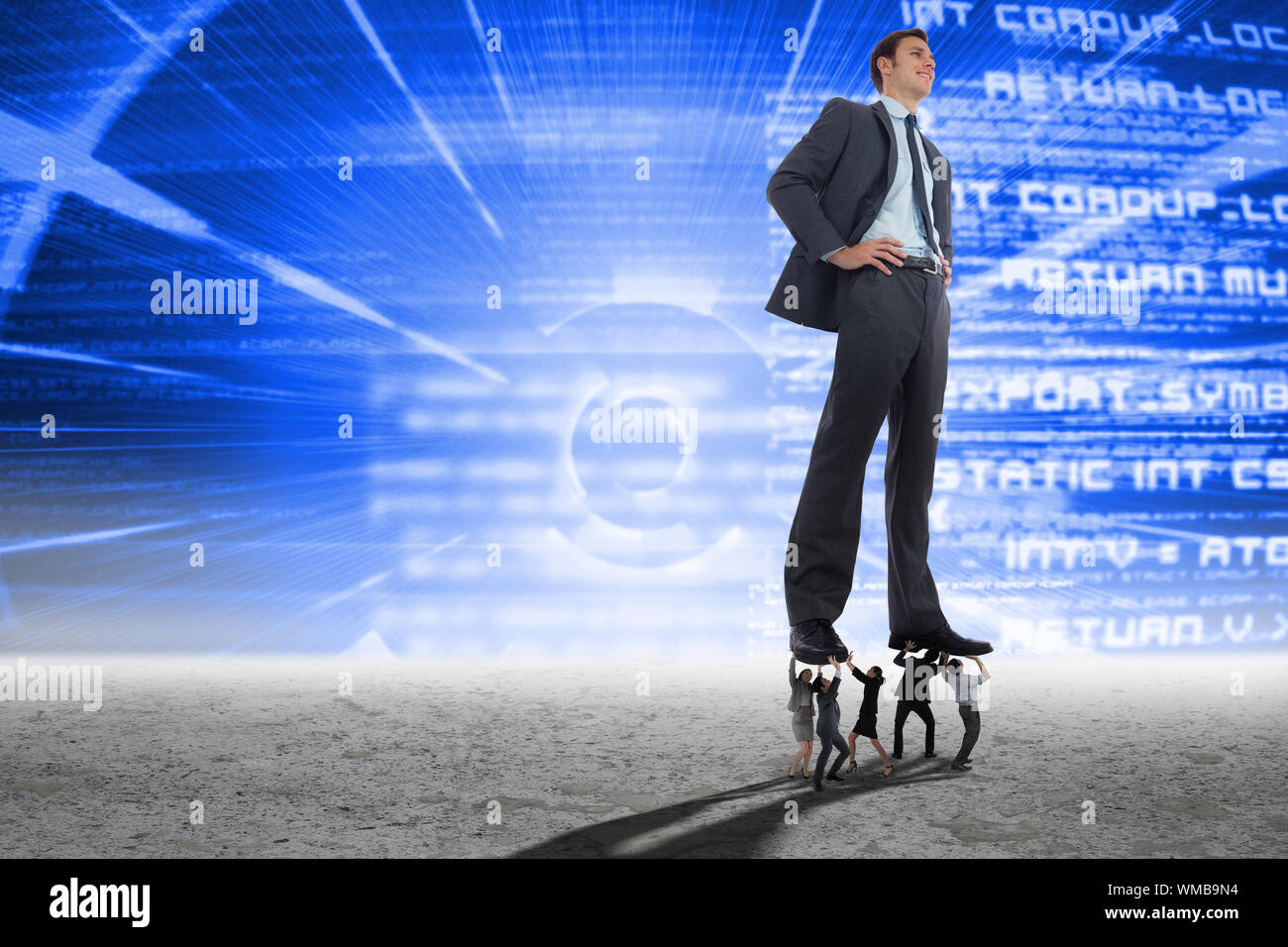 Business people supporting boss against blue technology interface Stock Photo