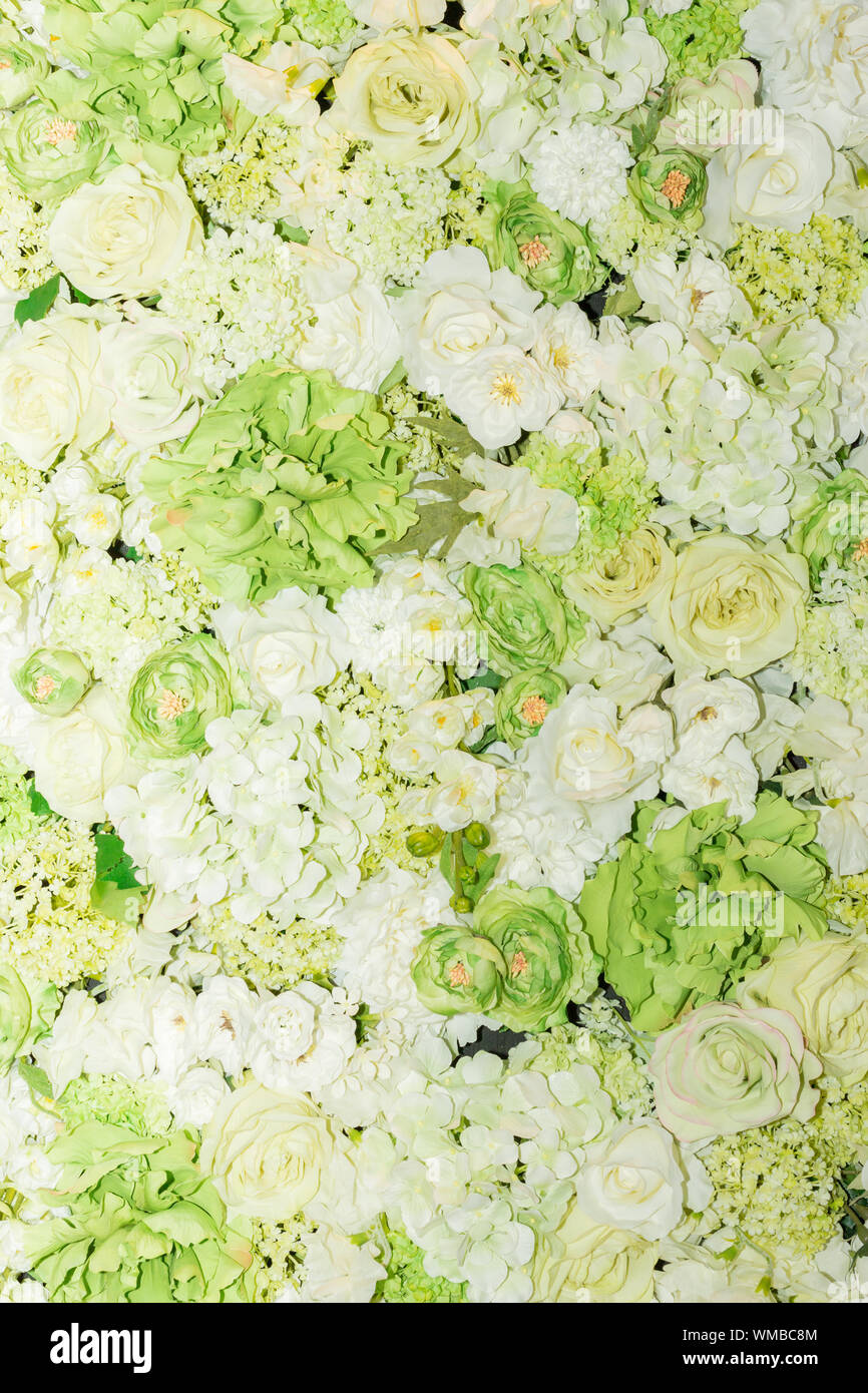 Beautiful green artificial flowers background. flowers decor Stock