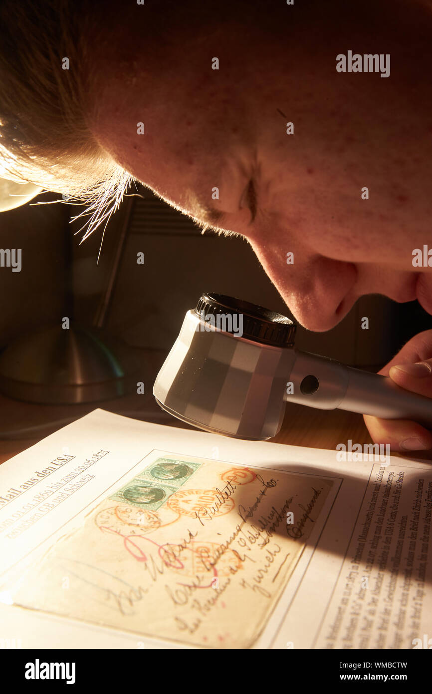 Neuwied, Germany. 03rd Sep, 2019. Stamp collector Kevin Weigt (20) looks at a letter from his collection that was sent from Princeton (Massachusetts) to Switzerland in 1873. Hundreds of thousands collect stamps in Germany. (Zu dpa: 70 years of stamps of the Federal Republic - still young collectors). Credit: Thomas Frey/dpa/Alamy Live News Stock Photo