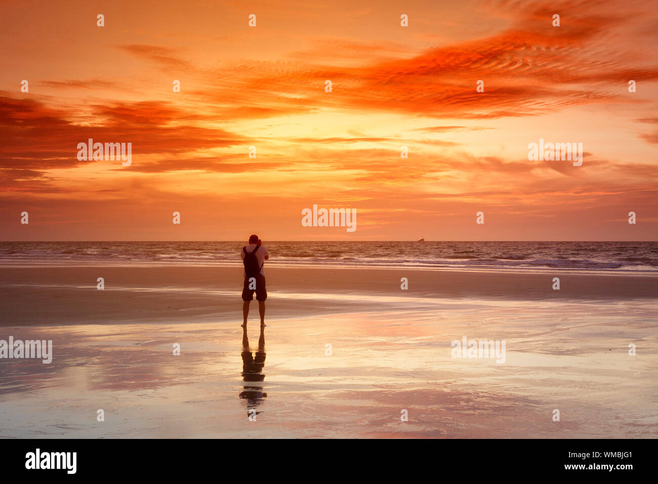 An image of a photographer at the sunset sea Stock Photo - Alamy