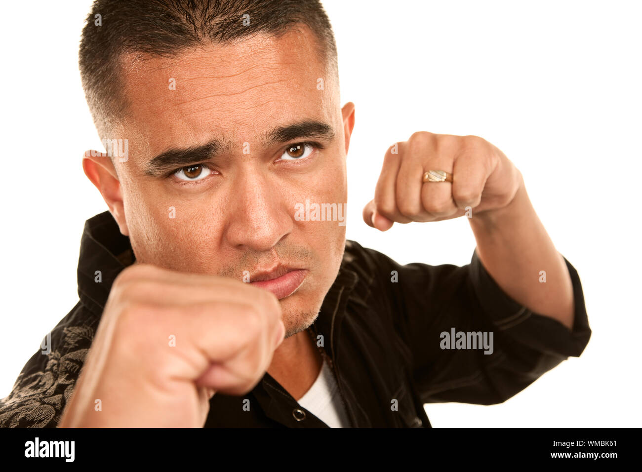 Hispanic man preparing to throw a punch Stock Photo Alamy