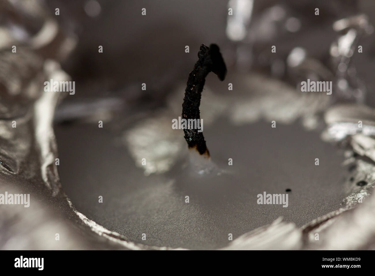 Burnt extinguished wick on a candle Stock Photo Alamy