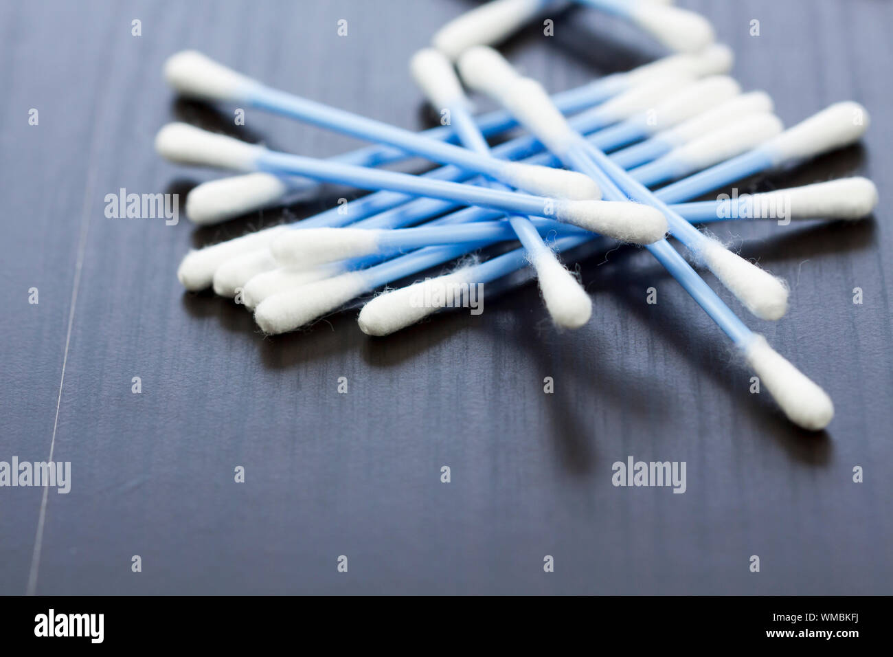 Random pile of blue plastic cotton ear buds for cleaning wax out of the