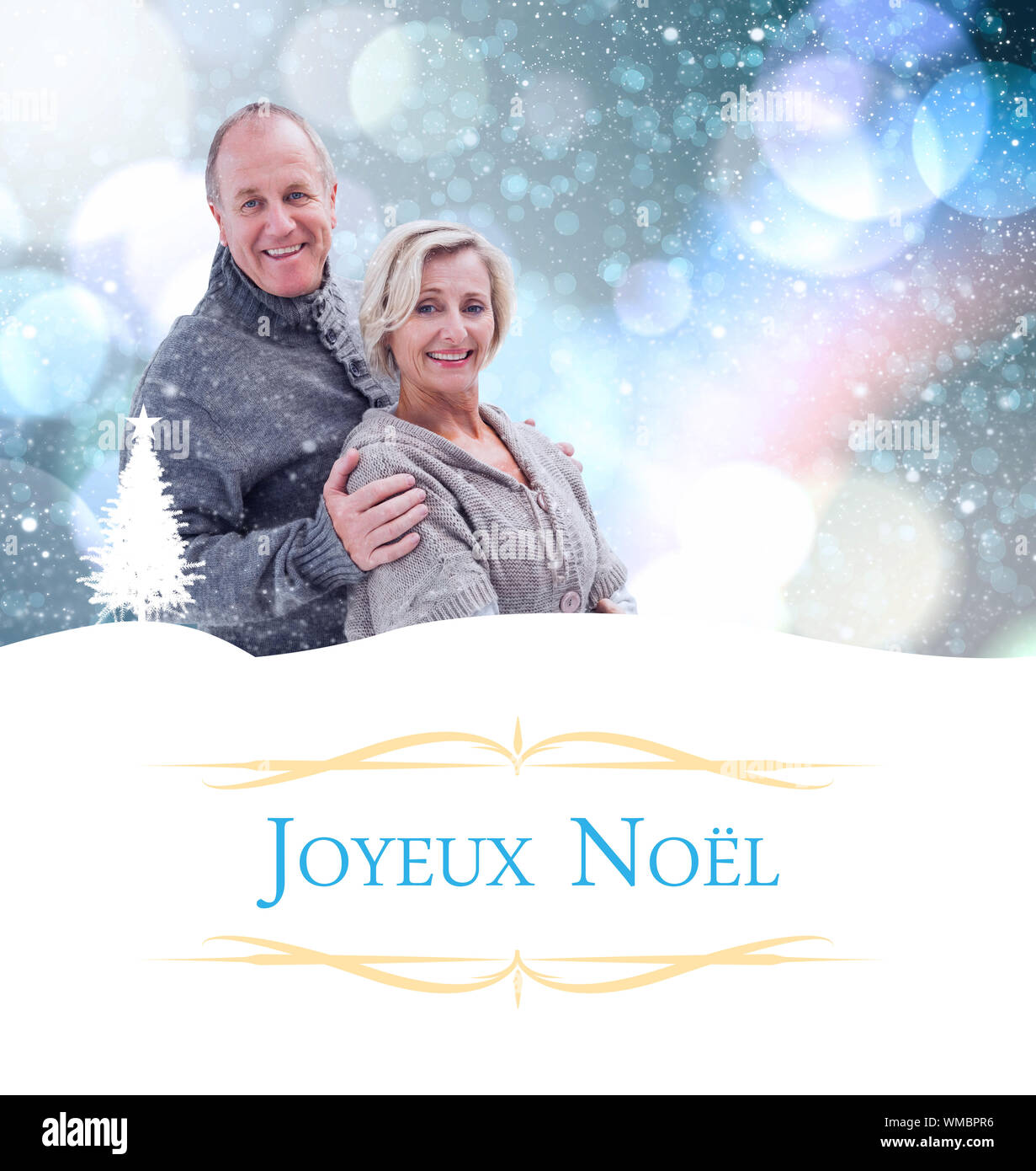 mature winter couple against Christmas greeting card Stock Photo