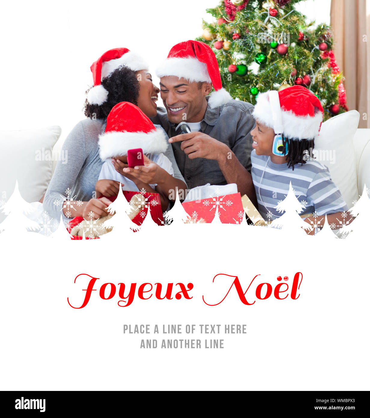 Happy Family Having Fun With Christmas Presents Against Joyeux Noel Stock Photo Alamy