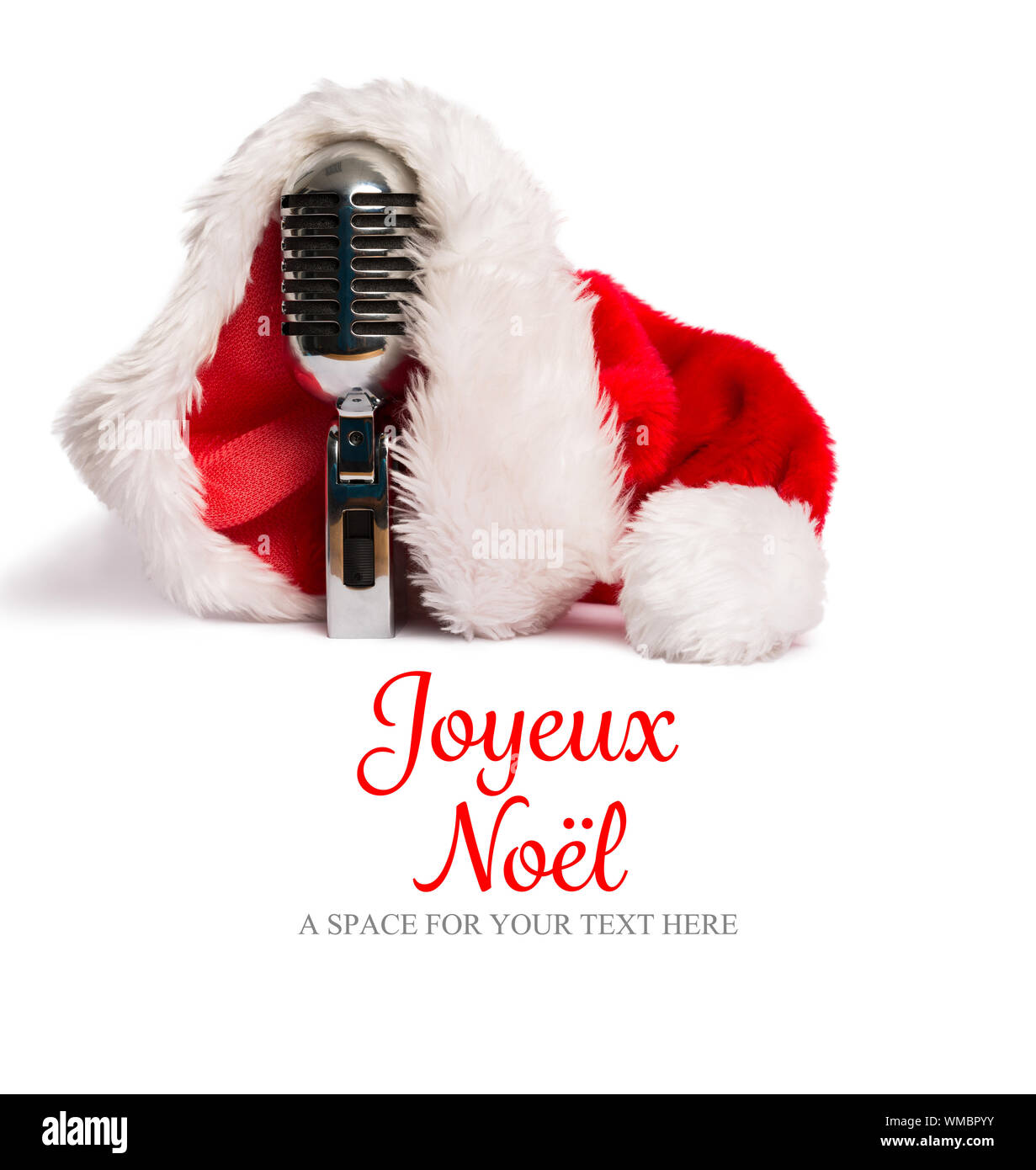 Joyeux Noel Against Vintage Mic With Santa Hat Stock Photo Alamy