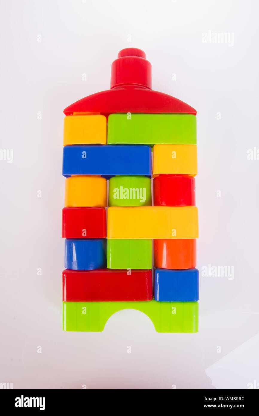 Stack Of Multi Colored Toy Blocks Against White Background Stock Photo ...