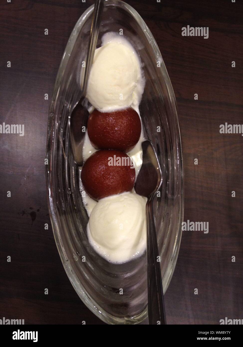 Download High Angle View Of Gulab Jamun With Ice Cream In Container On Table Stock Photo Alamy PSD Mockup Templates