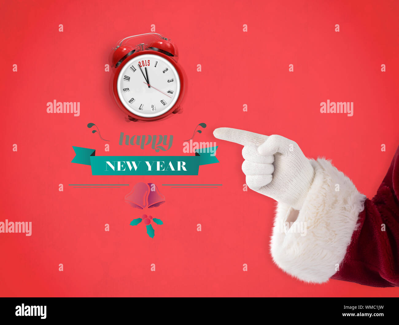 Santa Claus points at something against red background Stock Photo