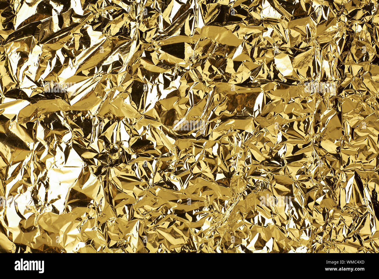 https://c8.alamy.com/comp/WMC4XD/crumpled-golden-foil-shining-texture-background-bright-shiny-gold-luxury-design-metallic-glitter-surface-holiday-decoration-backdrop-concept-gold-WMC4XD.jpg