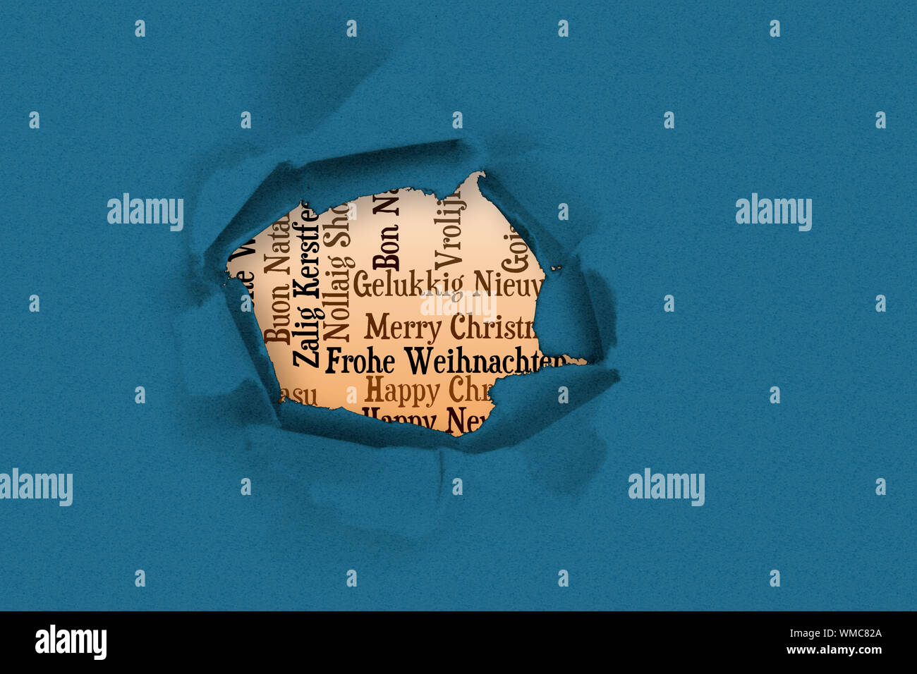 Circle Hole In Paper Against Holiday Greetings In Different Languages circle-hole-in-paper-against-holiday-greetings-in-different-languages