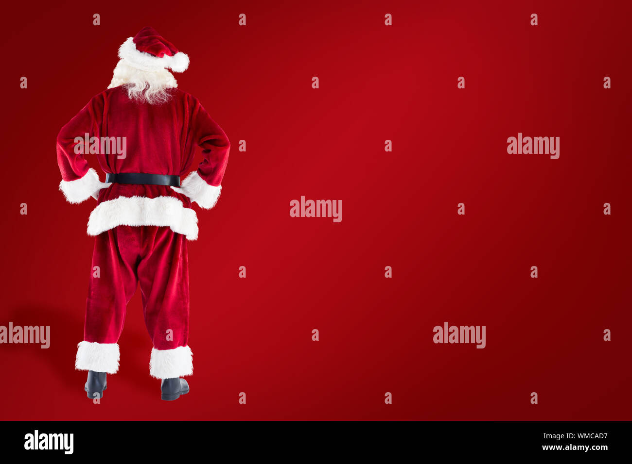 Santa Claus against red background Stock Photo