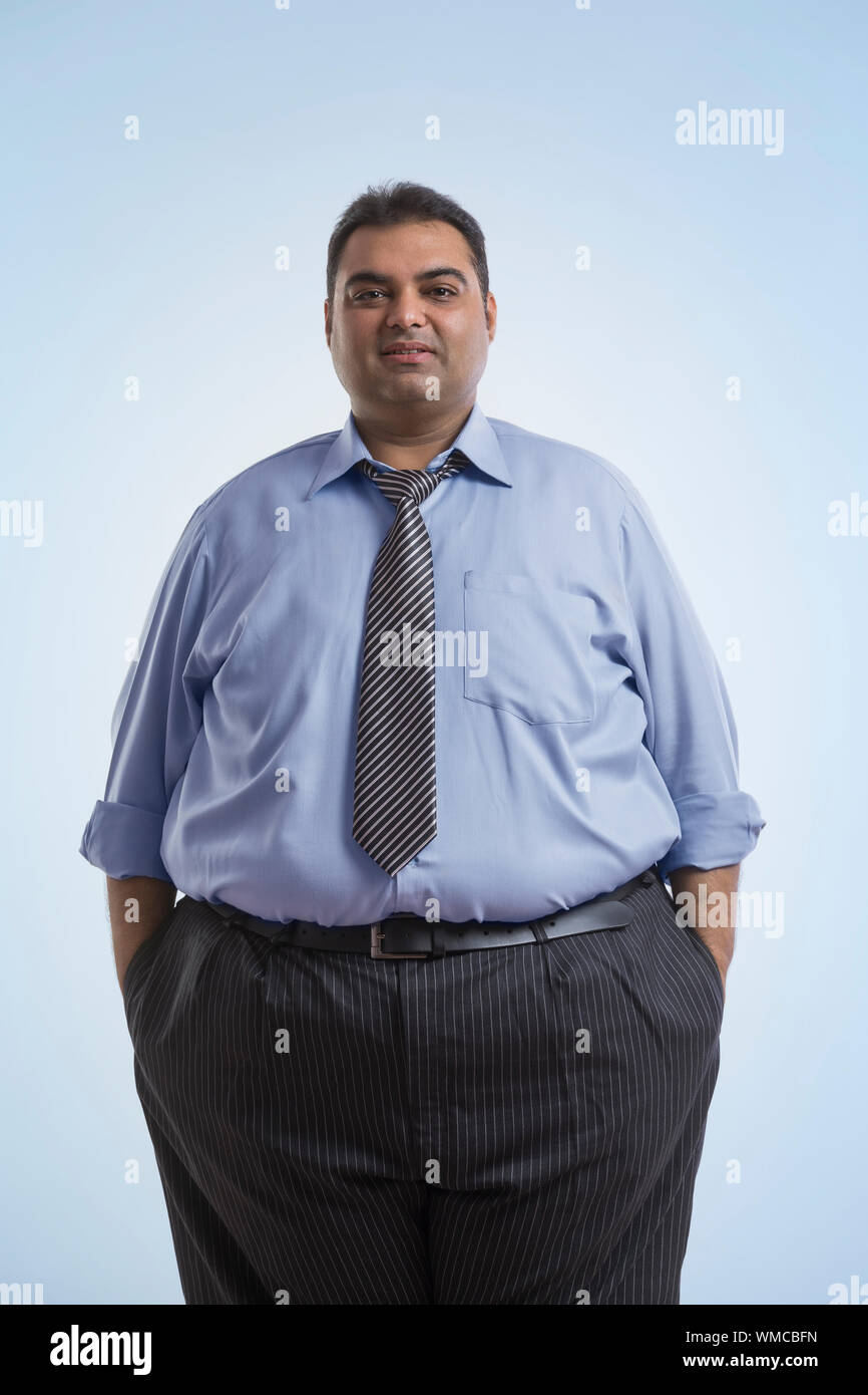 Portrait of obese man in formal clothes standing with hands in pocket Stock  Photo - Alamy