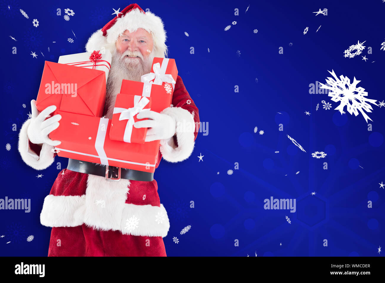 Santa carries a few presents against blue snowflake background Stock ...