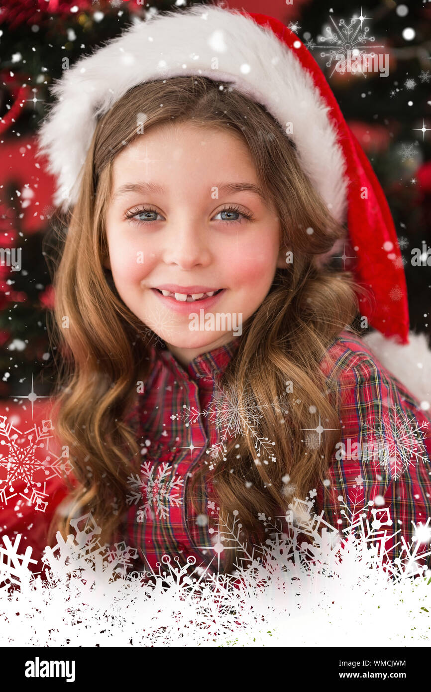 Festive little girl smiling at camera against snow falling Stock Photo ...
