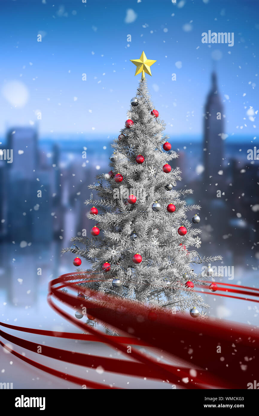 Composite image of christmas tree with falling snow Stock Photo - Alamy
