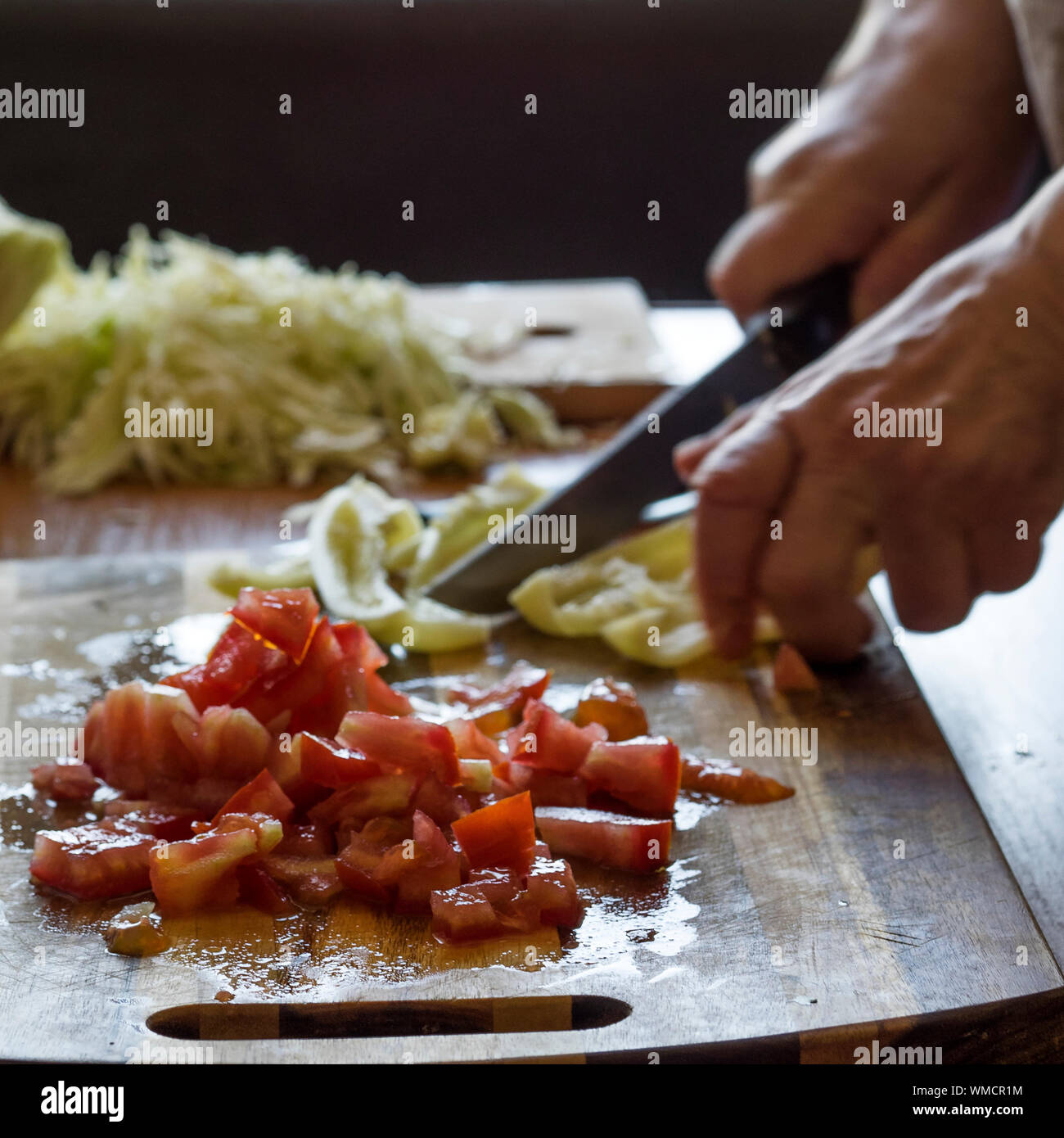 Human Hand Slicing Vegetables Stock Photo