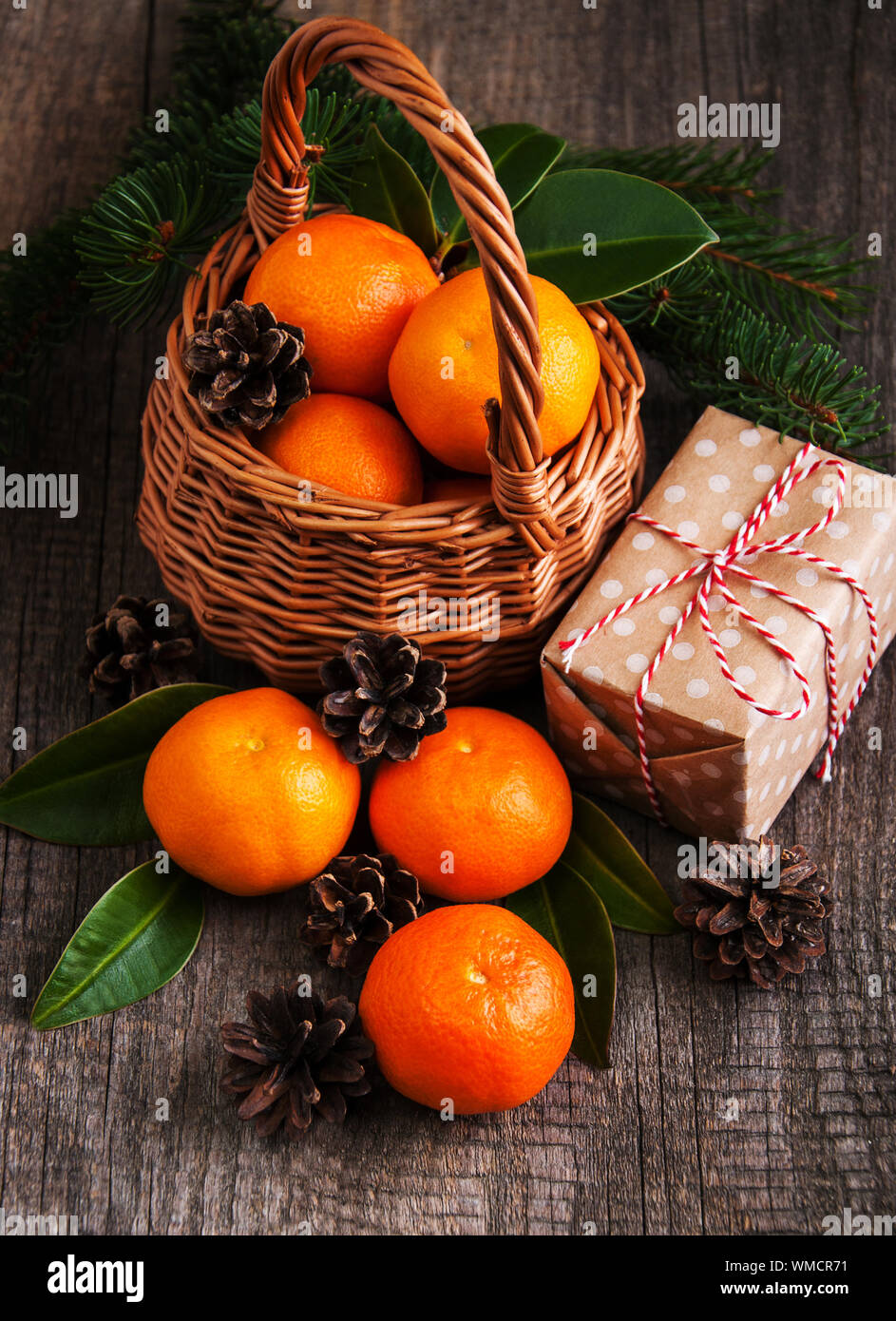 Christmas composition with tangerines and gift box Stock Photo