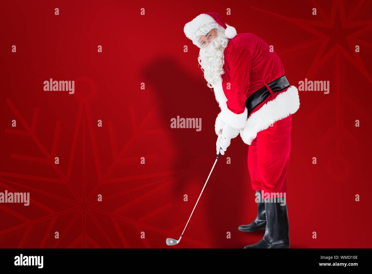 Happy santa claus playing golf against red snowflake background Stock Photo  - Alamy