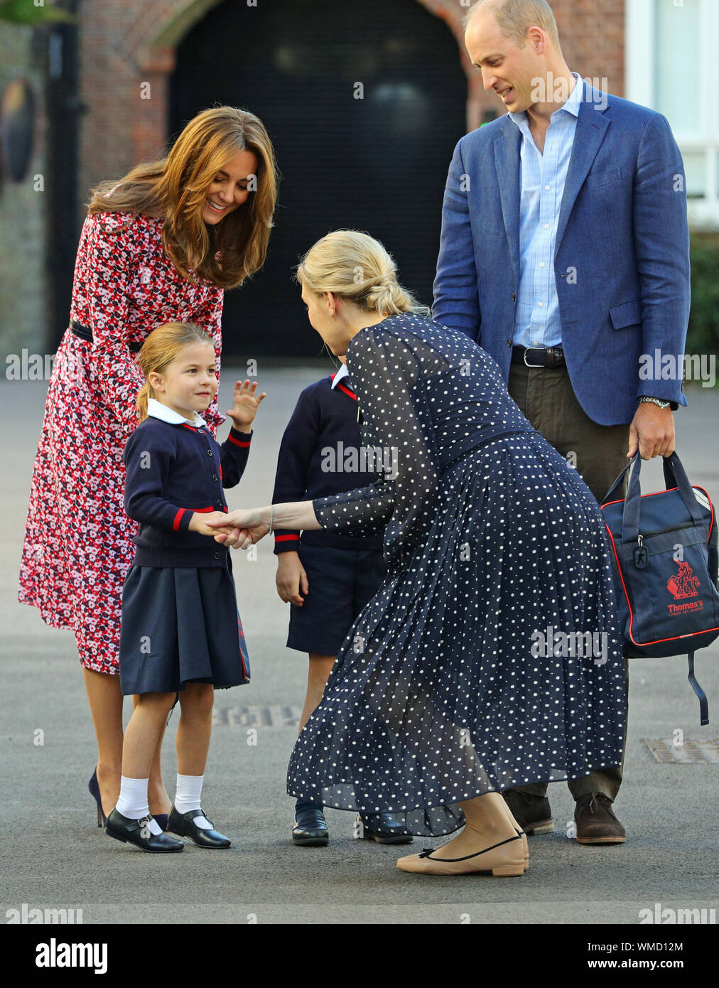 Helen Haslem, head of the lower school greets Princess Charlotte as she