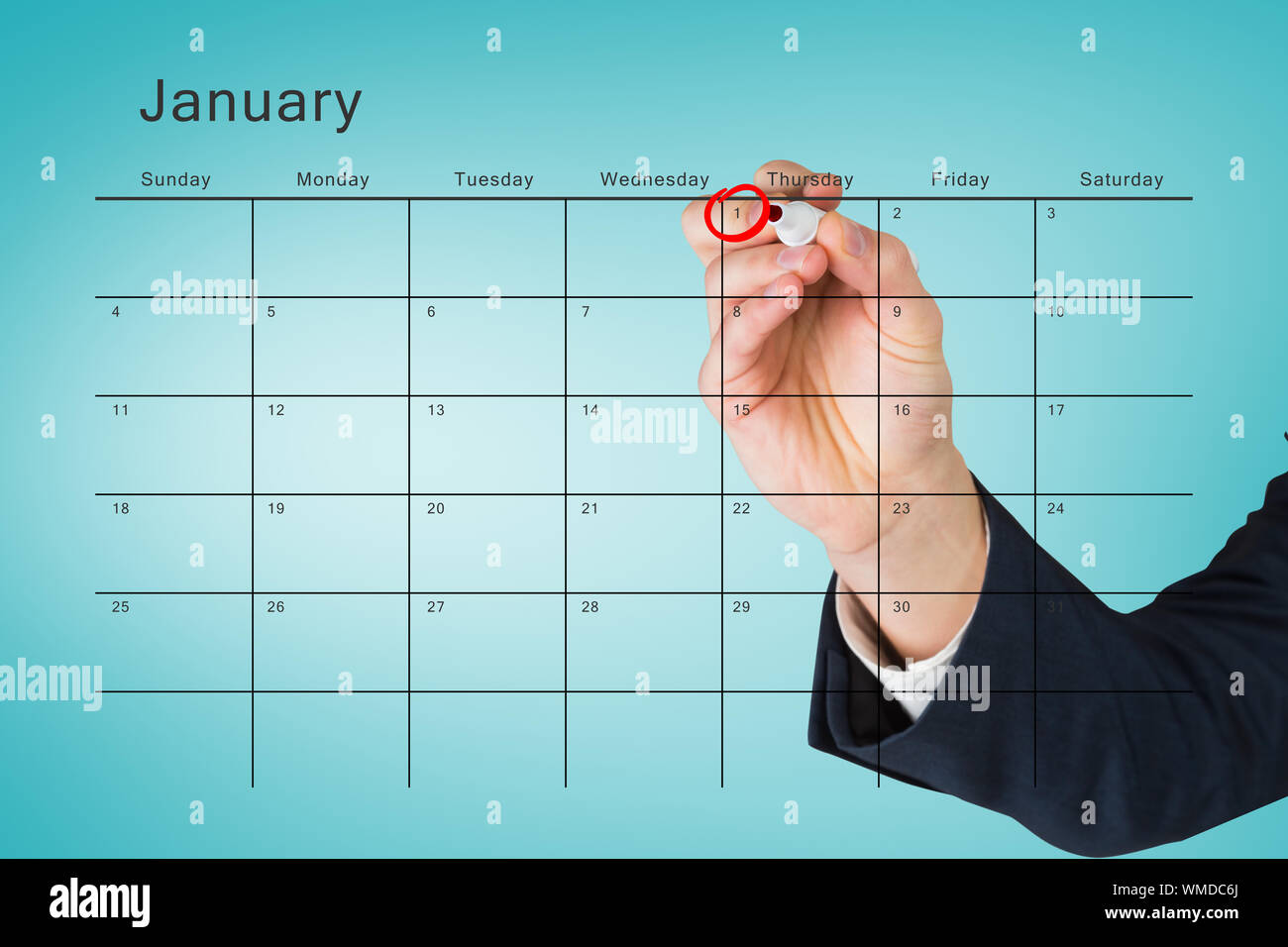 Hand writing with a marker against january calendar Stock Photo - Alamy