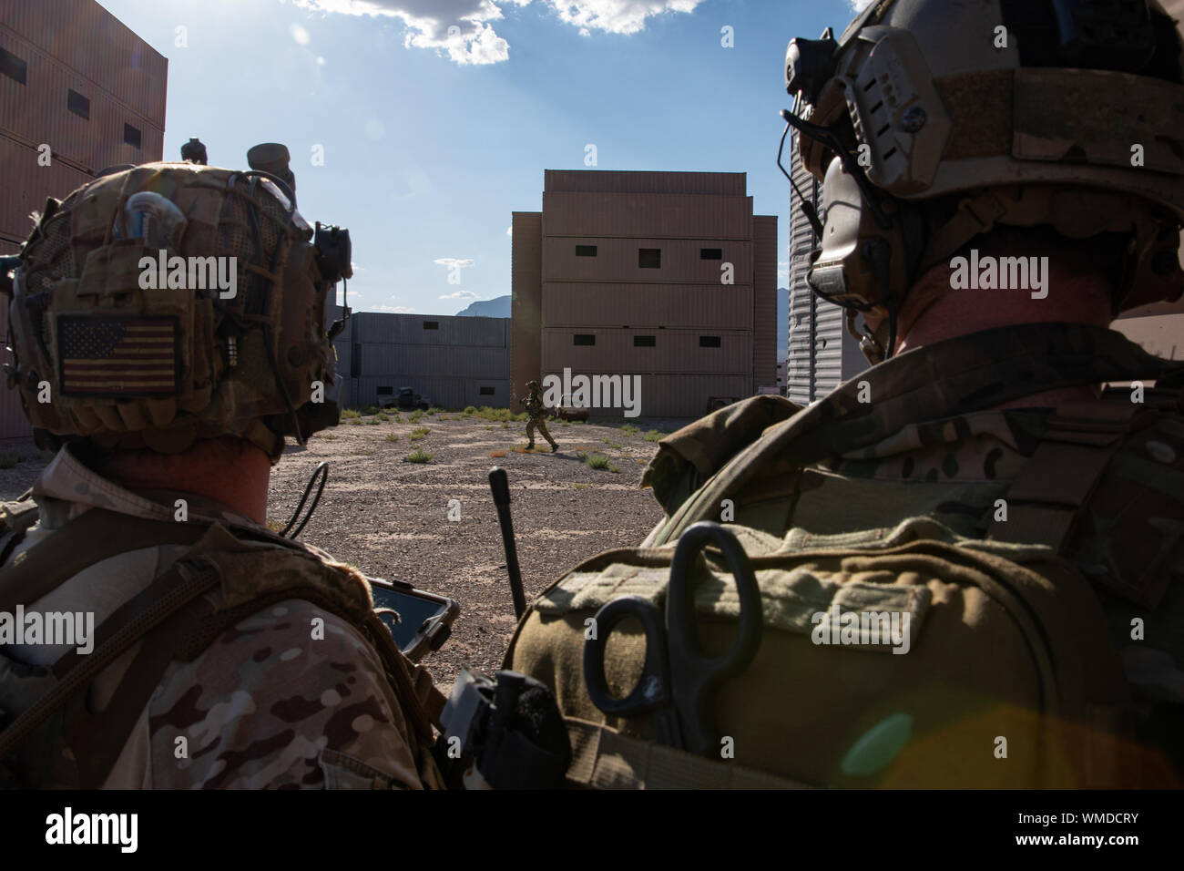 Green Berets assigned to 3rd Special Forces Group (Airborne) clear a compound during a training event near Nellis Air Force Base, Nev. Aug. 27, 2019. U.S. Special Forces and U.S. Air Force Joint Terminal Attack Controllers conducted a raid and utilized multiple weapon systems ranging from smalls arms weapons to A-10 Thunderbolt ll aircraft. (U.S. Army photo by Sgt. Steven Lewis) Stock Photo