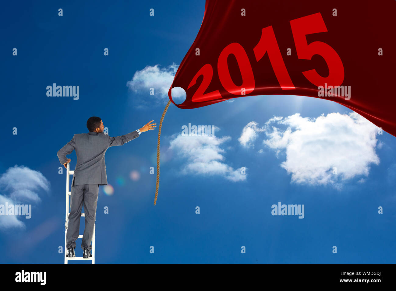 Businessman standing on ladder against bright blue sky with clouds ...