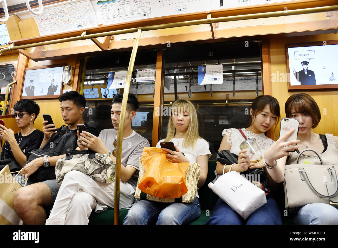 Smartphone users in Tokyo Subway Tokyo Street Scene Japan Stock